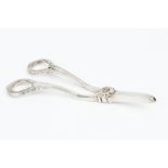A PAIR OF SILVER GRAPE SCISSORS, by Asprey & Co Ltd, with foliate cast handles and flowerhead hinge,