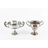AN EDWARDIAN SILVER TWIN-HANDLED TROPHY CUP, on pedestal foot, by Nathan & Hayes, Chester 1906, 13cm