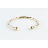 A 9CT GOLD TORQUE BANGLE, hallmarked for Birmingham 1992, inner diameter 6.4cm