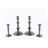 A PAIR OF SILVER CANDLESTICKS, with knopped stems, on weighted circular bases, by William Comyns &