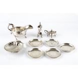 A SMALL COLLECTION OF SILVER, comprising a sauce boat, Birmingham 1935, a butter shell, a pepper and