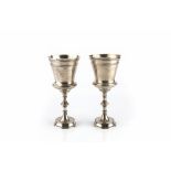 A PAIR OF LATE VICTORIAN SILVER GOBLETS, with tapered baluster bodies, on knopped stems and circular