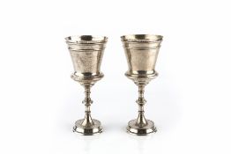 A PAIR OF LATE VICTORIAN SILVER GOBLETS, with tapered baluster bodies, on knopped stems and circular