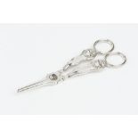 A PAIR OF GEORGE III SCOTTISH SILVER GRAPE SCISSORS, with scroll and shell cast decoration, by