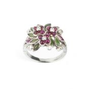 A DIAMOND AND GEM SET PANEL RING, modelled as a spray of cabochon ruby and green stone flowerheads
