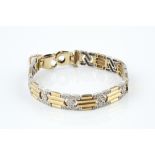 A DIAMOND SET PANEL BRACELET, designed as a series of geometric panels, each millegrain set with