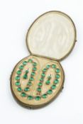 A COLLECTION OF 19TH CENTURY GREEN PASTE JEWELLERY, comprising a rivière necklace, the line of