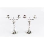 A PAIR OF CONTINENTAL MINIATURE CANDELABRA, with baluster knopped stems and detachable twin branch