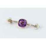 AN AMETHYST, PEARL AND DIAMOND BROOCH, centred with a cushion-shaped amethyst in millegrain collet