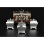 A SET OF THREE GEORGE III SILVER TEA CADDIES of rectangular bombe form, the covers with pinecone