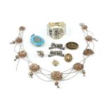 A COLLECTION OF ANTIQUE AND LATER JEWELLERY, comprising a white metal filigree panel necklace, a