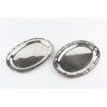 TWO GRADUATED MEXICAN SILVER OVAL PLATTERS, with foliate cast borders, stamped Sterling 925, largest