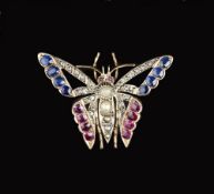 A LATE VICTORIAN DIAMOND AND VARI GEM-SET BUTTERFLY BROOCH, modelled with pierced outstretched wings