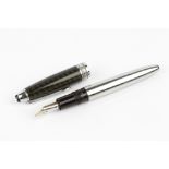 A MONT BLANC MEISTERSTUCK FOUNTAIN PEN with carbon steel body and chequered lid, and with service