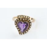 AN AMETHYST AND HALF PEARL PANEL RING, centred with a heart-shaped mixed-cut amethyst, within a half