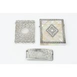 A VICTORIAN SILVER CARD CASE, of shaped rectangular outline, engraved with stylised foliage, by