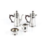 A SILVER FOUR PIECE BACHELOR'S COFFEE SERVICE, comprising coffee pot and hot water pot, with domed