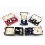 A COLLECTION OF SILVER, comprising a three piece cruet set, Birmingham 1934, another three piece