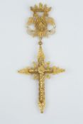 AN ORNAMENTAL FILIGREE CROSS PENDANT, the ornate cross suspended from a double headed eagle with