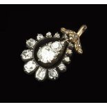 A 19TH CENTURY DIAMOND CLUSTER PENDANT, centred with a pear-shaped drop of cushion-shaped old-cut