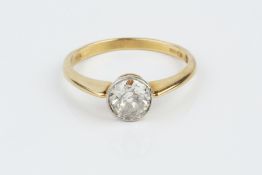 A DIAMOND SINGLE STONE RING, the old-cut diamond in millegrain collet setting, 18ct two colour