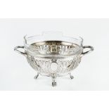 A CONTINENTAL SILVER TWIN HANDLED BOWL, pierce decorated and embossed with swags of husks, on paw