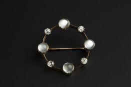 A MOONSTONE AND DIAMOND CIRCLET BROOCH, alternately set with old-cut diamonds and circular moonstone
