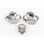 A PAIR OF EDWARDIAN SILVER BUTTER DISHES, of lobed and scalloped form, the shaped edges repousse