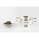 A SILVER TWIN HANDLED BOWL, of shallow, girdled form, with leaf capped scroll handles by William