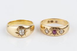 TWO DIAMOND SET GYPSY RINGS, the first a ruby and diamond three stone ring, 18ct gold mounted, the