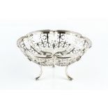 A SILVER SWEETMEAT BASKET, of lobed design, the sides pierced with quatrefoil motifs, on three