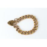 A LATE VICTORIAN/EDWARDIAN CURB-LINK BRACELET, of hollow construction, with alternate polished and