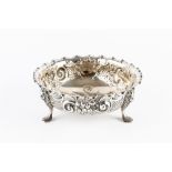 A LATE VICTORIAN SILVER BOWL, with shaped and crimped rim, embossed and engraved with flowers and '