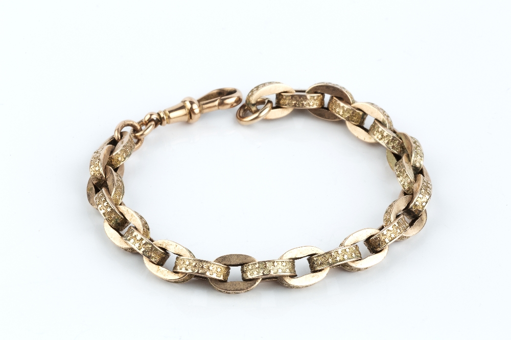 A FANCY-LINK BRACELET, comprising a series of star decorated links, with swivel clasp stamped '9 .