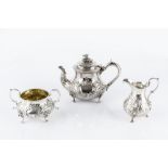 A MID VICTORIAN SILVER BACHELOR'S TEAPOT, the baluster body embossed and engraved with flowers and