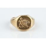 A 9CT GOLD SIGNET RING, the octagonal panel incised with a boar and arrow crest, hallmarked for