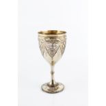 A MID VICTORIAN SILVER GILT GOBLET, the sides embossed and chased with fruiting vine, on beaded