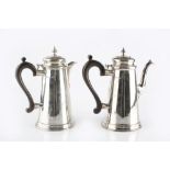 A SILVER COFFEE POT of tapered form, with hinged domed cover, and composite handle, by C.J. Vander