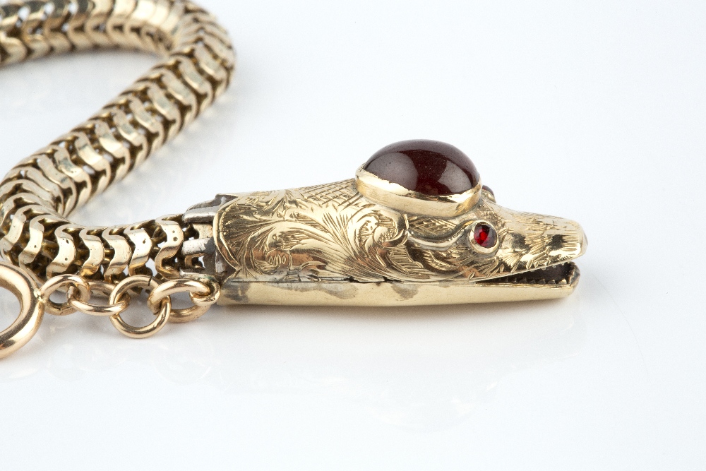 A SERPENT BRACELET, the head with cabochon garnet highlight, faceted red stone eyes and foliate - Image 2 of 3