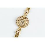 A RUBY AND DIAMOND SET BRACELET WATCH BY DELANEAU FOR KUTCHINSKY, the circular dial pavé set with