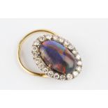 A BLACK OPAL AND DIAMOND CLUSTER RING, the oval cabochon black opal measuring approximately 16.2mm