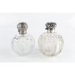 A LATE VICTORIAN SILVER TOPPED CUT GLASS SCENT BOTTLE, the hinged top repoussé decorated with