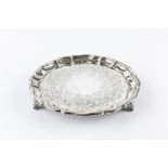 A MID VICTORIAN SILVER SMALL SALVER, with piecrust border, engraved with scrolling foliage, on