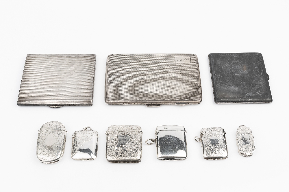 A COLLECTION OF SIX VICTORIAN AND EDWARDIAN SILVER VESTA CASES, five of them with foliate engraved