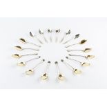 A SET OF TWELVE VICTORIAN SILVER ICE-CREAM SPOONS, with silver gilt bowls and twist stems, by Reid &