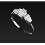 A DIAMOND SINGLE STONE RING, the round brilliant-cut diamond in eight claw setting, between