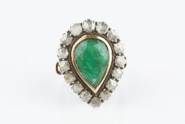AN EMERALD AND DIAMOND CLUSTER RING, the pear-shaped mixed-cut emerald collet set within a border of