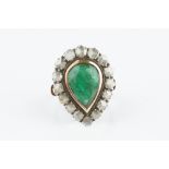 AN EMERALD AND DIAMOND CLUSTER RING, the pear-shaped mixed-cut emerald collet set within a border of