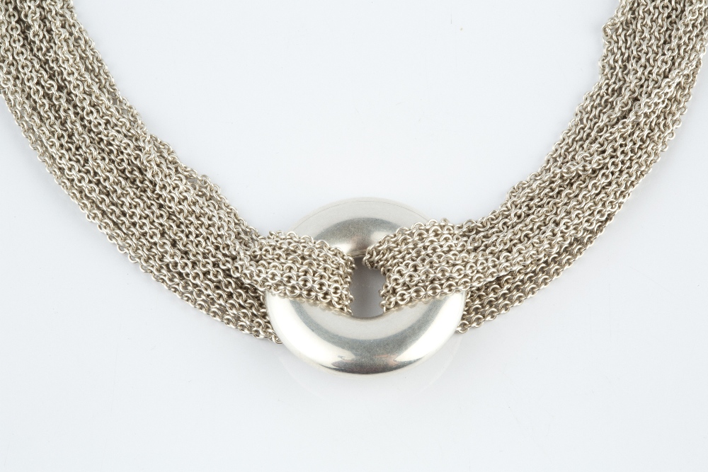 A COLLAR NECKLACE BY TIFFANY & CO., the multi-strand trace-link necklace with central circular panel - Image 2 of 2