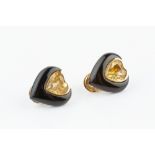 A PAIR OF CITRINE AND ONYX EAR CLIPS, each heart-shaped panel centred with a mixed-cut citrine